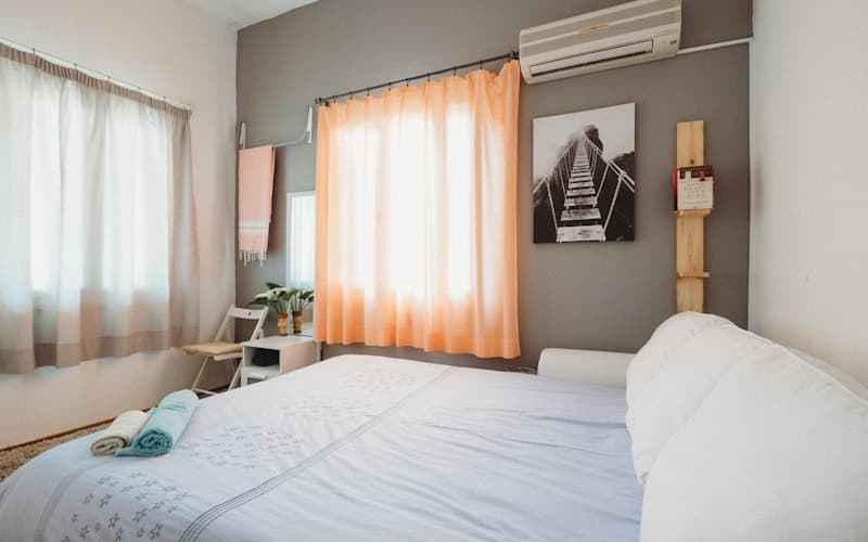 white bedspread inside room